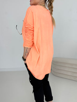 Langarmshirt in Orange mit asymmetrischem Schnitt