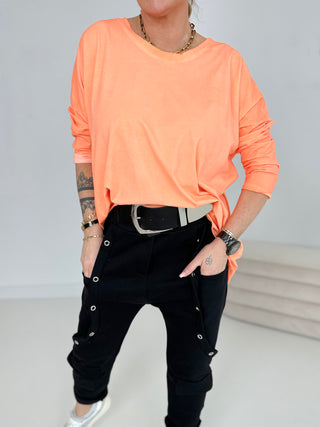 Langarmshirt in Orange mit asymmetrischem Schnitt
